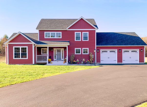 New two-story red house with a garage