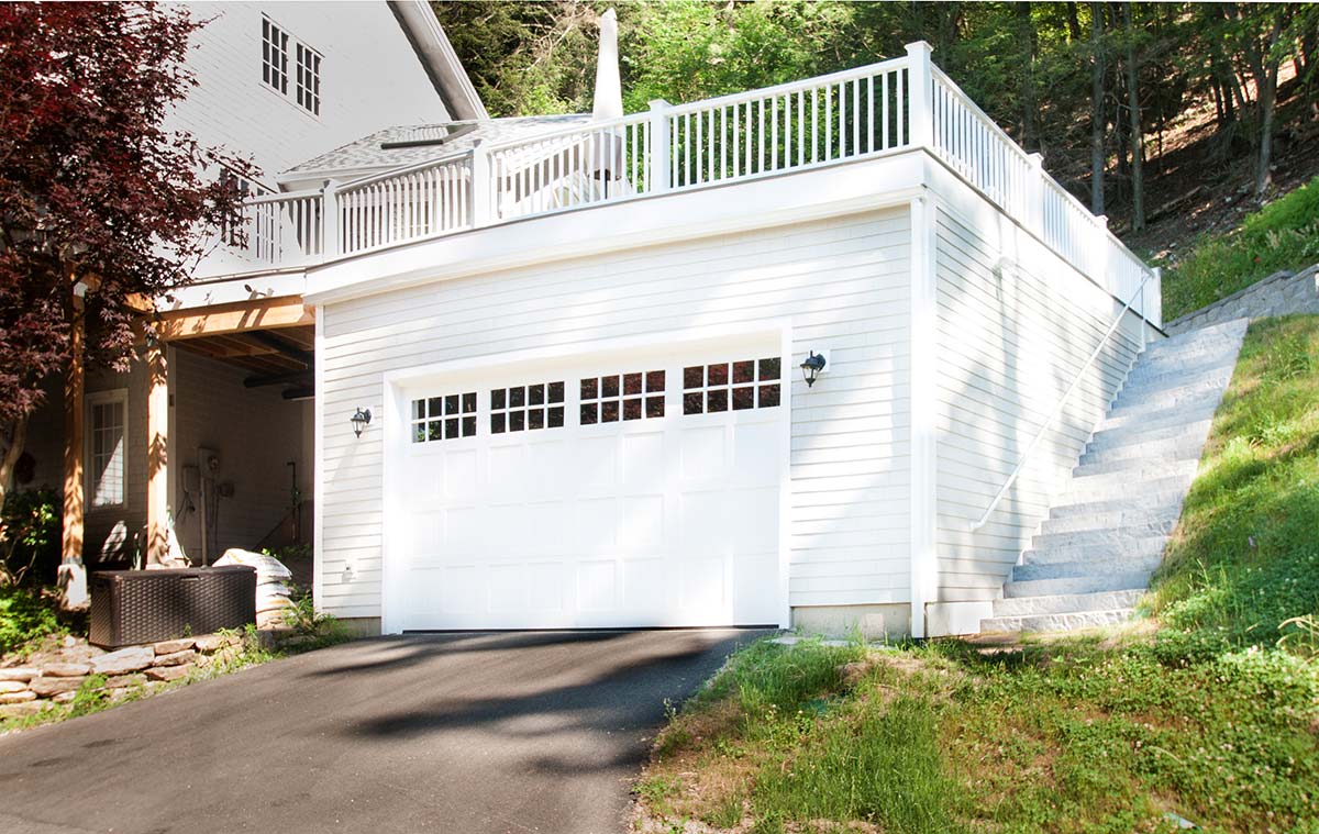 Photograph of an energy-efficient sunroom and deck addition completed by Integrity Development & Construction in Leverett, MA.
