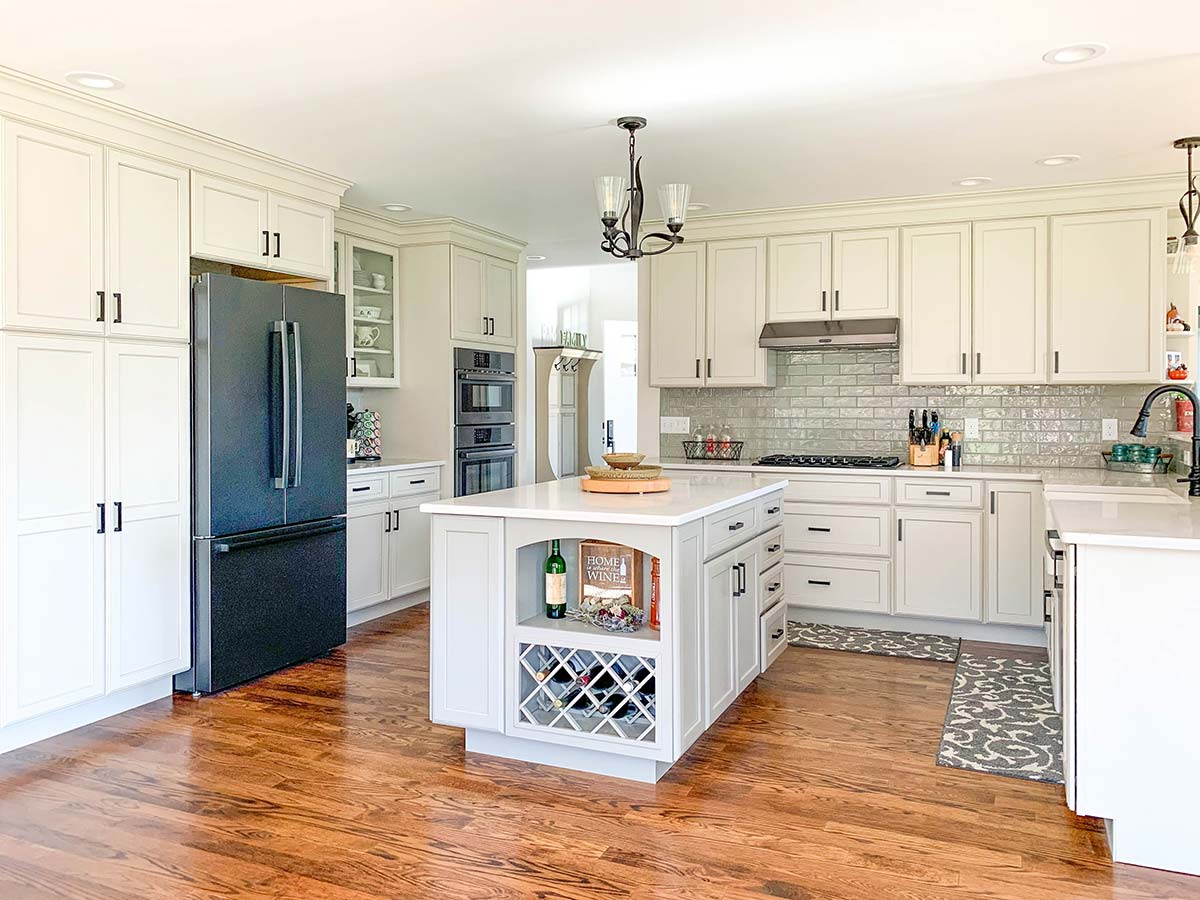 Photograph of an Aging-in-Place custom home with an attached garage and detached outbuilding built by Integrity Development & Construction in Southampton, MA.