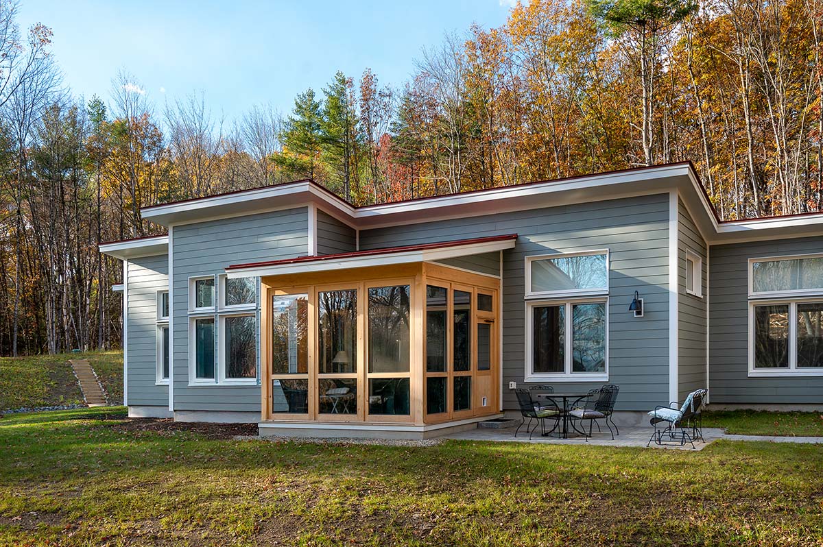 Photograph of an Aging-in-Place Unity Home featuring an attached garage and outdoor shower built by Integrity Development & Construction in Gill, MA.